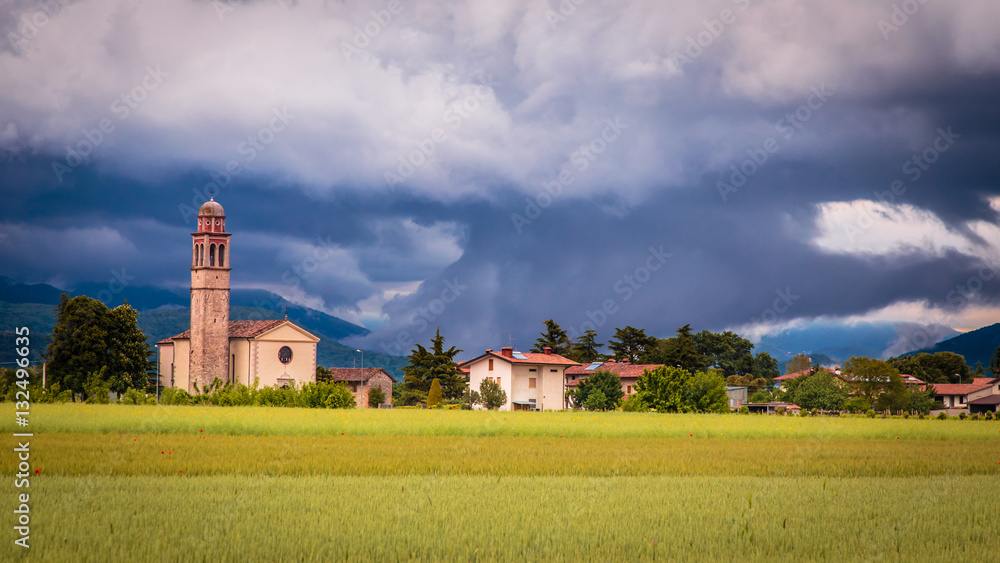 Fototapeta premium Evening storm over the medieval village