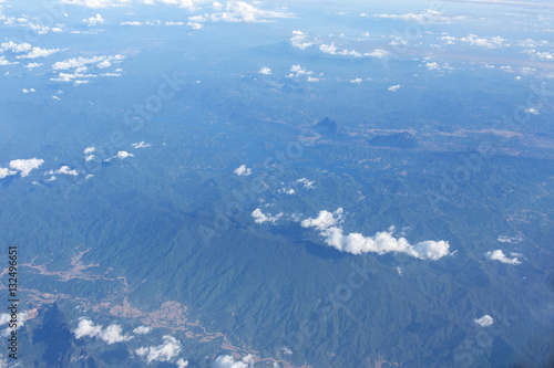 Cuadro en lienzo Aerial view on clouds and blue sky from airplane window