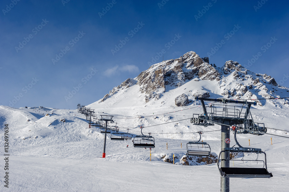 Fototapeta premium Ski lift in mountains at winter