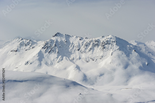 Alpine winter mountain landscape. French Alps with snow. © haveseen