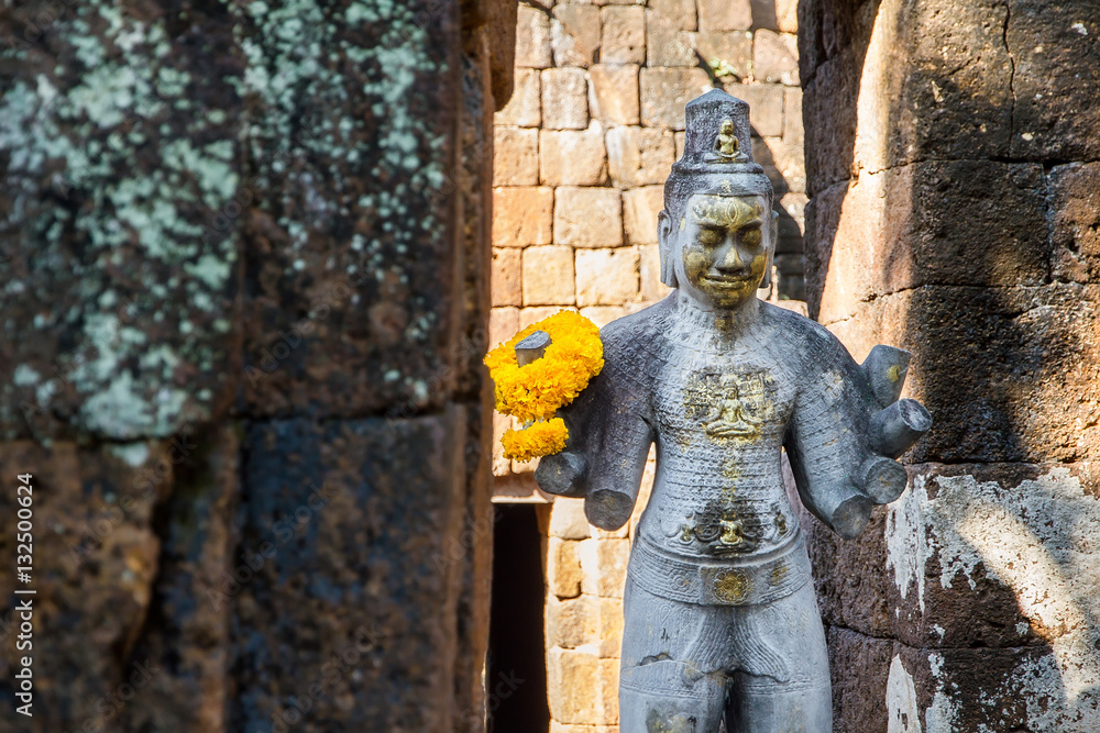 Sandstone statue of god Khmer Art at ancient thai castle or Pras Sandstone statue of god Khmer Art at ancient thai castle or Pras