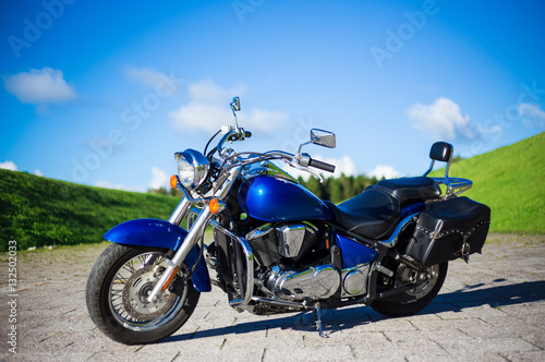 blue retro motorcycle on the road