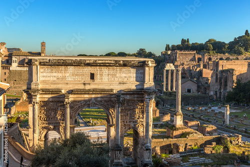 Rome, Italy. Arch of Septimius Severus (203) and the ruins of the Roman Forum photo