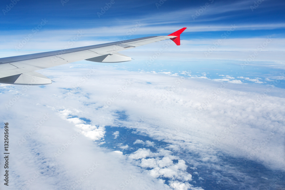 Fototapeta premium Above the clouds.Wing aircraft on the sky