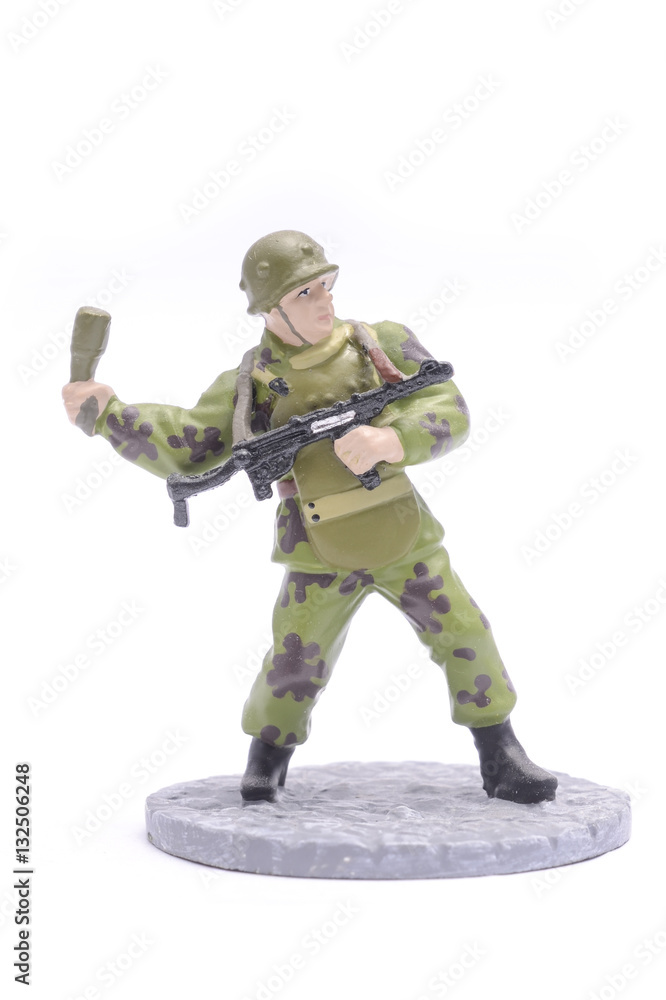 Tin Soldier throws grenade isolated on white Tin Soldier throws grenade isolated on white