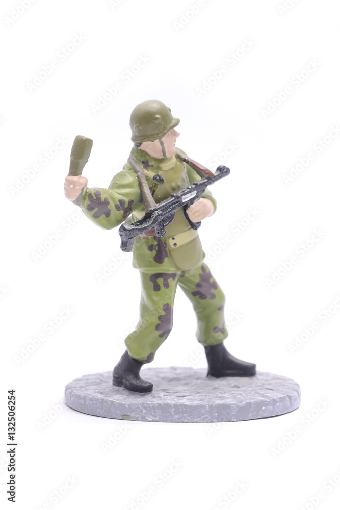 Tin Soldier throws grenade isolated on white Tin Soldier throws grenade isolated on white