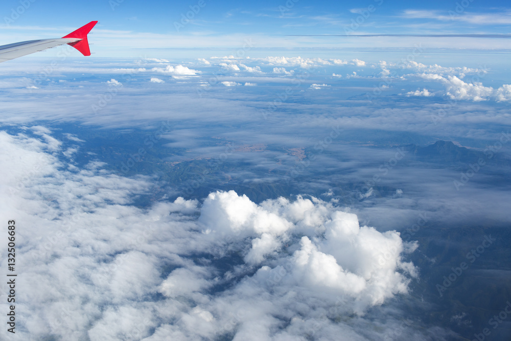 Fototapeta premium Above the clouds.Wing aircraft on the sky