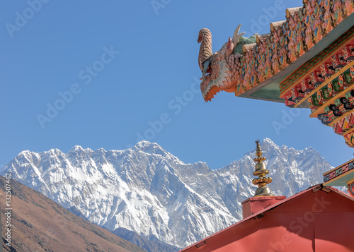 TENGBOCHE, NEPAL - OCTOBER 30: A mythical dragon guards the gate (right). Festival of Tengboche Monastery Practice and Masked Mani Rimdu Dances to the Khumbu region on October 30, 2012 in Tengboche photo