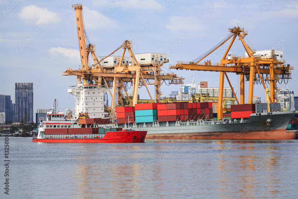 ship cargo containers and bulk cargo ship to harbor freight and yellow cranes