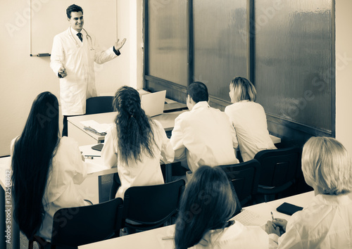 Health-care workers during educational program in school photo