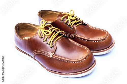 Leather man's shoes on white background