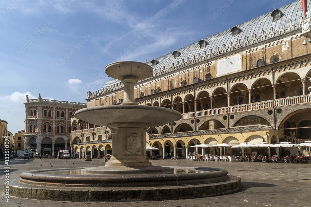 The fountain in Piazza delle Erbe and the Palazzo della Ragione in a moment of tranquility, historic center of Padua, Veneto, Italy