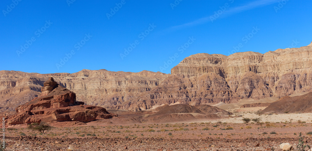 Timna park - Mount Screw with desert mountains and blue sky in the background