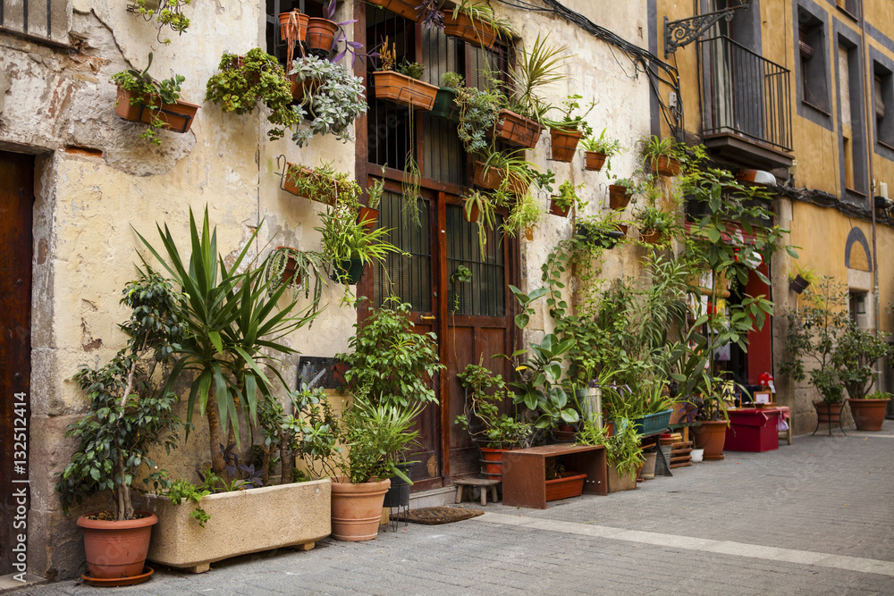 Old house in Barcelona, decorated with flowers