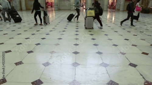 People walking on a patterned floor at Union Station in Washington DC. No faces.