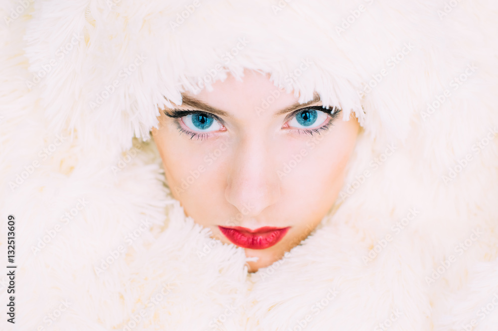 Portrait of young beautiful girl in retro style in fur, stand at gaze