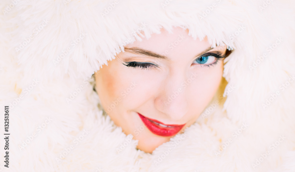 Portrait of young beautiful girl in retro style in fur, wink to the camera