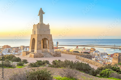 Statue of Christ staying above the Almeria city photo