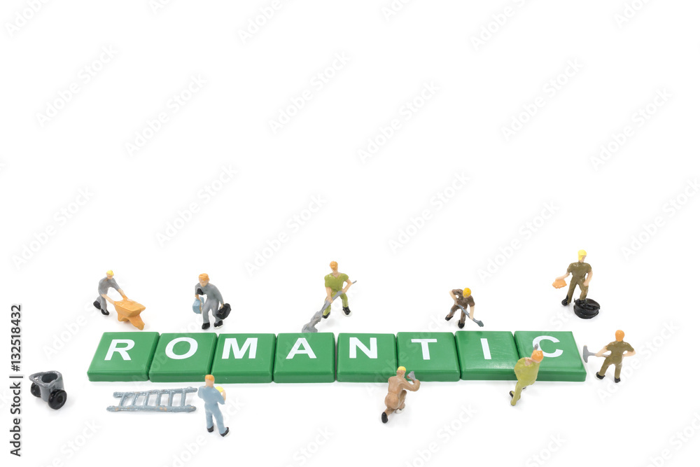 Miniature worker team building word romantic on white background Miniature worker team building word romantic on white background