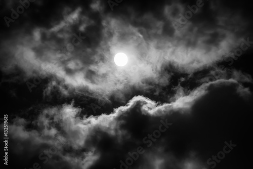 The moon on the dark sky among the clouds, natural abstract background