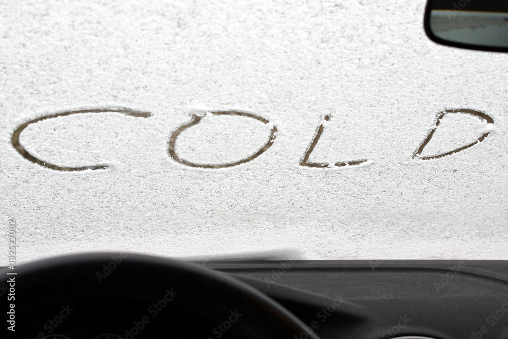 Word cold written to car windshield. View from inside. Word cold written to car windshield. View from inside.