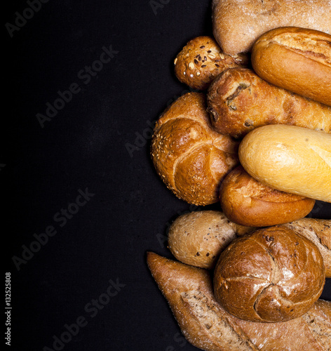 Assortment of baked goods on black table