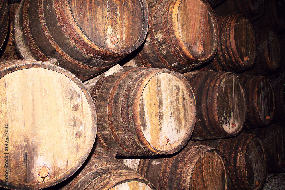 Many old wood barrels on a wine factory