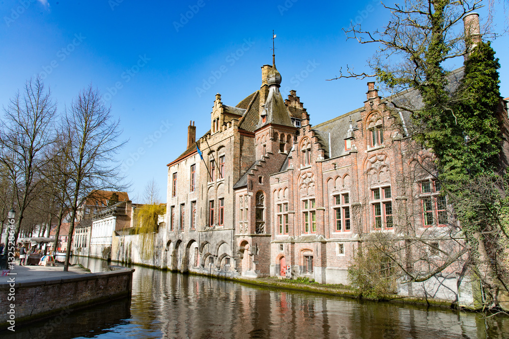 Historic brick house in Bruges with beautiful canal