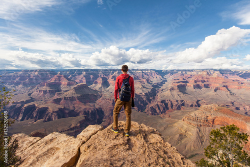 Travel in Grand Canyon, man Hiker with backpack enjoying view, USA © nikolas_jkd