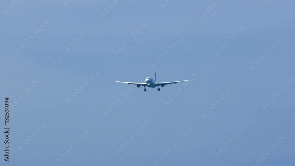 Approaching airplane over the sea Approaching airplane over the sea