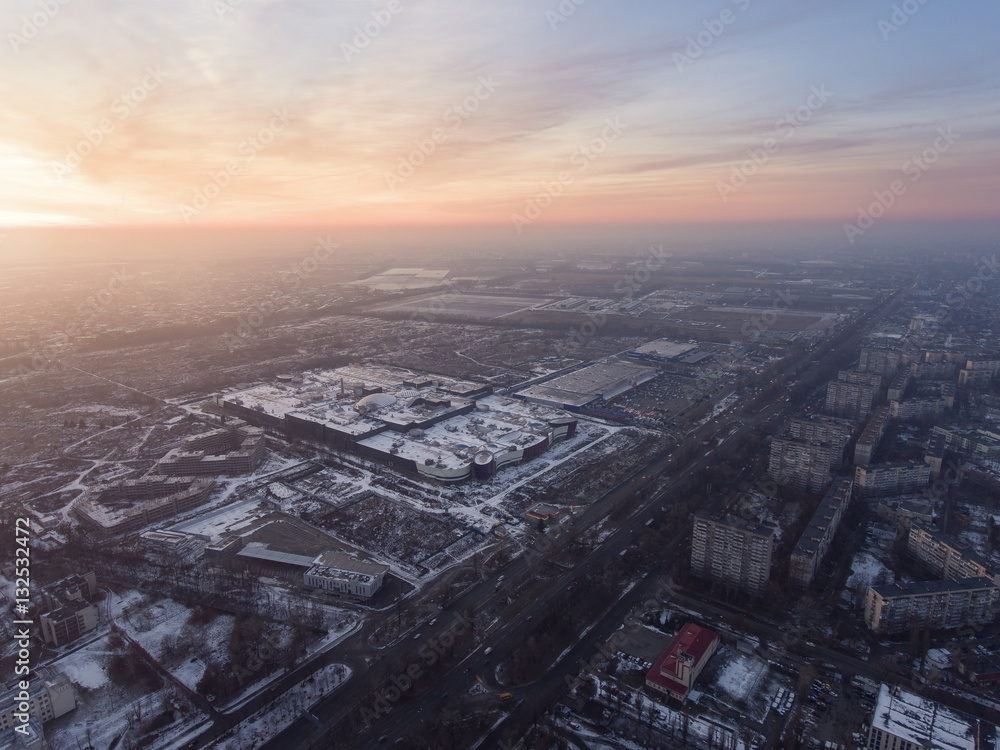 Huge supermarket in Kiev, Ukraine. Aerial view of mall at sunset time.