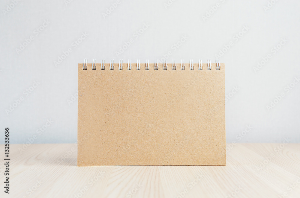 Blank brown paper on wooden table background, mock up calender or menu, copy space. Blank brown paper on wooden table background, mock up calender or menu, copy space.
