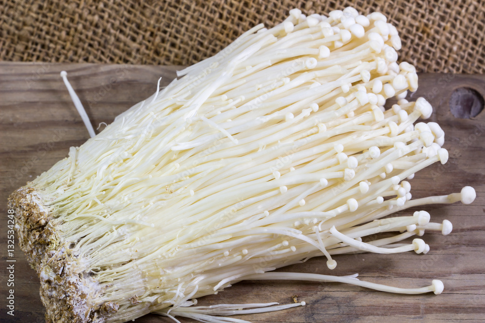 Enoki mushroom, Fresh Golden needle mushroom in plant nursery background. Enoki mushroom, Fresh Golden needle mushroom in plant nursery background.