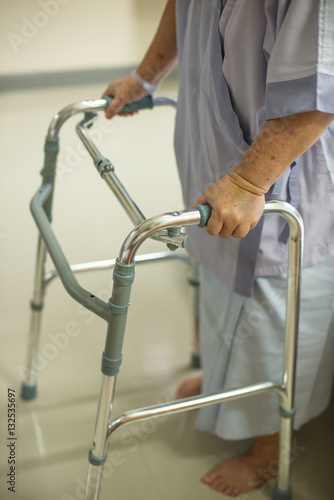 senior woman using a walker in hospital