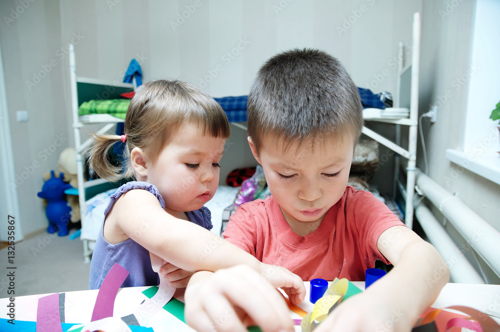 children development - brother and sister playing together