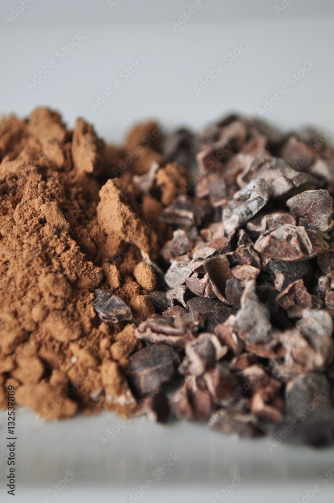 Raw cacao powder and crushed cocoa beans Raw cacao powder and crushed cocoa beans