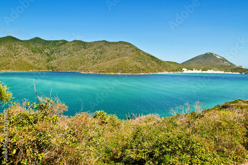 Top view of marine channel to the island, with view to the beach of ilha do farol at Arraial do Cabo, Brazil