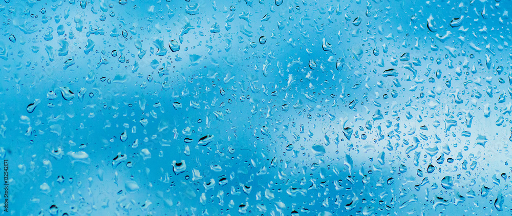 Rainy wet cold blue sky eco seasonal natural abstract background with water drops Rainy wet cold blue sky eco seasonal natural abstract background with water drops