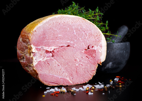 Принти на полотні Butcher's deli ham with sea salt, chilli flakes, mortar and pestle as background