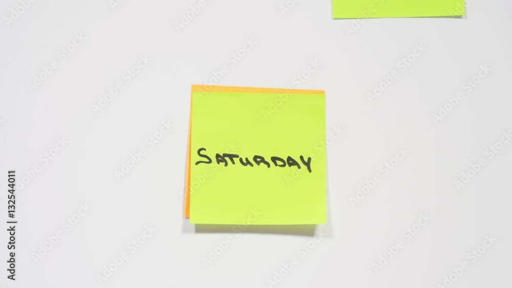 Seven days of week written on orange and green stickers, monday, tuesday, wednesday, thursday, friday, saturday, sunday, making notes for every day. Close up, stop motion, 4K Ultra HD. Seven days of week written on orange and green stickers, monday, tuesday, wednesday, thursday, friday, saturday, sunday, making notes for every day. Close up, stop motion, 4K Ultra HD.