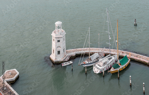 Yachting harbour at the foot of the bell tower of the Saint Giorgio Maggiore Church - Venice, Italy