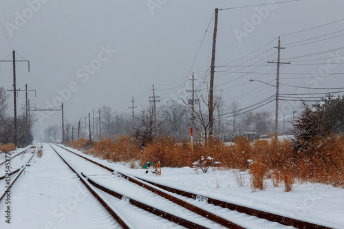 Snow covered railway crossing photo