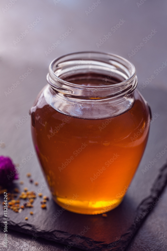 Sweet honey in the glass jar. Sweet honey in the glass jar.