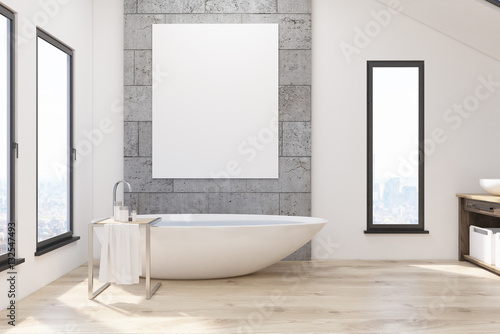 bathroom with white tub and poster