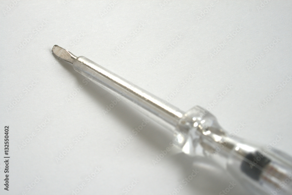 Electrician's insulated Screwdriver on white Electrician's insulated Screwdriver on white