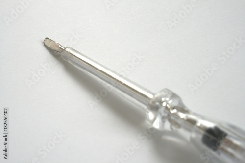 Electrician's insulated Screwdriver on white