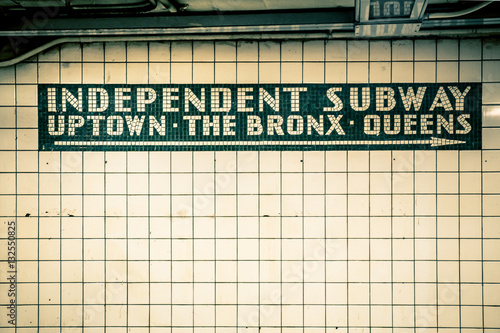 Retro tiled wall in New York City subway station with vintage filter effect