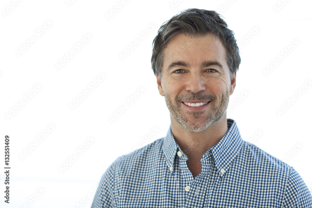 Portrait Of A Handsome man Isolated On white. Smiling Portrait Of A Handsome man Isolated On white. Smiling