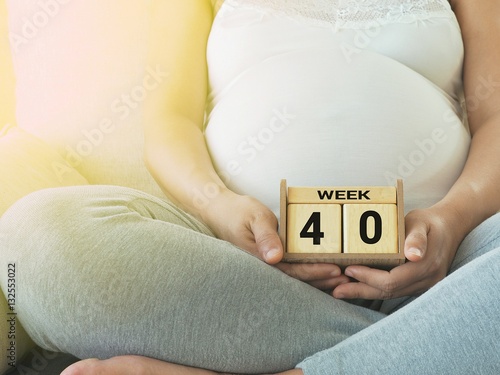 Calendar with weeks 40 of pregnant with pregnancy woman background. Maternity concept. Expecting an upcoming baby. Due date countdown.