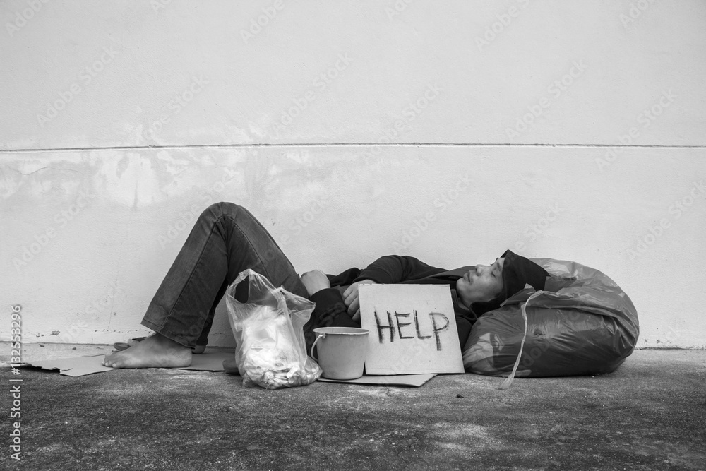 Φωτογραφία Homeless person sleep on sidewalk of the street